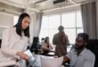 woman in white long sleeve shirt sitting beside man in gray shirt